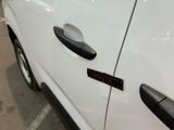 a close up of a car door handle with a sticker on it