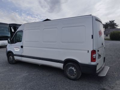 a white van that is parked in a parking lot