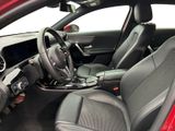 the interior of a red car with black leather seats and a steering wheel