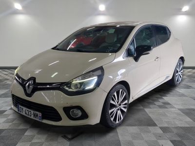 the white car is parked on a checkered floor in the garage