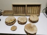 several pieces of wood are sitting on a table next to a box