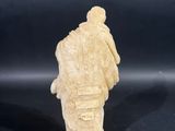 chinese carved ivory figurine of a man carrying a bag