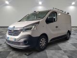 the white van is parked on a checkered floor in a room