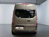 a tan van parked inside of a building