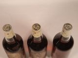 three bottles of wine sitting next to each other on a table