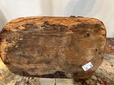 an old piece of wood sitting on top of a piece of wood