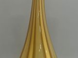 a yellow vase that is sitting on a table