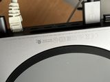 a close up of a computer with a cable connected to it