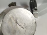 a person holding a metal object in their hand