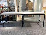 two benches sitting next to each other in a room