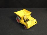 a yellow toy truck with a man in the back