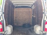 the back of a van with the door open and the back of the van with the door open