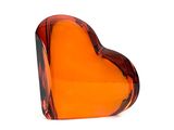 a glass heart shaped object on a white surface