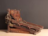 a wooden machine that is sitting on a table
