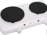 a close up of a stove top with two burners on it