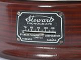 a close up of a wooden drum with a label on it
