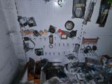 a room with a bunch of items on the wall