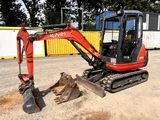 a small excavator that is sitting in the dirt