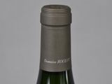 a bottle of wine that is sitting on a table