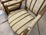 two chairs that are sitting in a room together