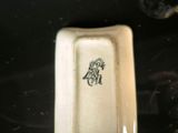 a close up of a white plate with a black design on it