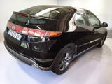 a picture of a black honda civic car parked in a garage