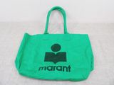 a green bag with a black logo on it