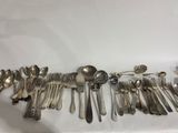 a lot of spoons and spoons on the table
