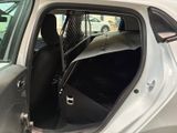a car with the door open and the passenger seat down