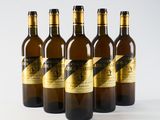 six bottles of wine are lined up on a white surface