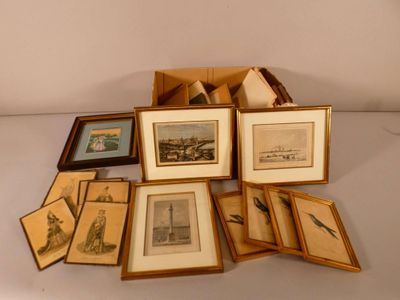 a lot of framed pictures on a white table