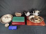 a group of silver plated items including a teapot, tray, and other items