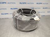 a coil of black hose sitting on top of a table