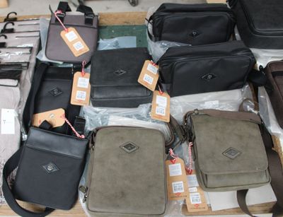 a lot of bags that are sitting on a table