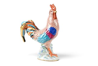 a figurine of a rooster on a white background