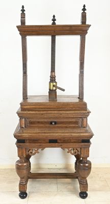 a small wooden table with a lamp on top of it