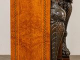 a wooden table with a statue on top of it