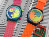 trois montres de couleurs différentes posées les unes sur les autres