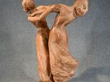 an image of a sculpture of two women holding hands