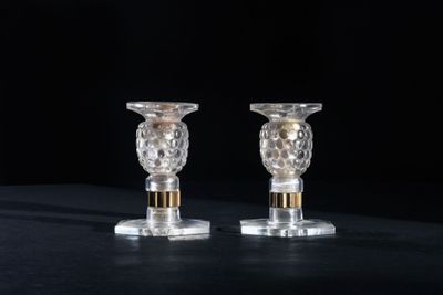 pair of crystal candlesticks on a black background