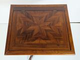 an image of a wooden table with a star design on it
