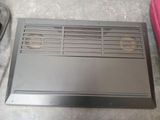 a picture of a ducted air conditioner sitting on the floor