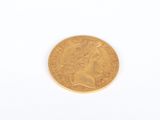 an image of a gold coin on a white surface