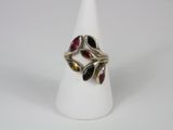 a close up of a ring with multi colored stones on it