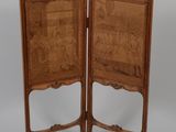 pair of antique wooden folding chairs with carved wood panels