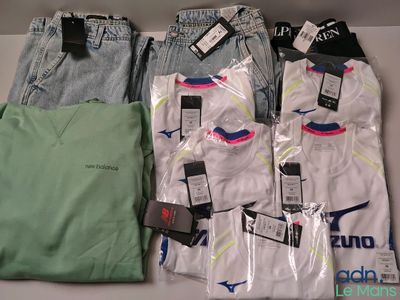 several pairs of men ' s clothing sitting on top of a table