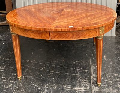 a round table with a drawer on the top of it