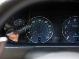 a close up of a car dashboard with gauges and speedometers