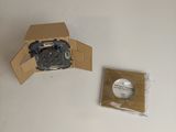a cardboard box with a camera attached to it next to a cardboard box with a camera attached to it