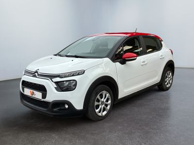 a white citrole is parked in a white room